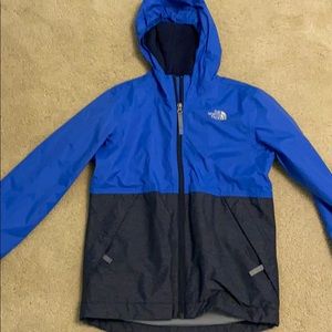 Blue and grey north face jacket